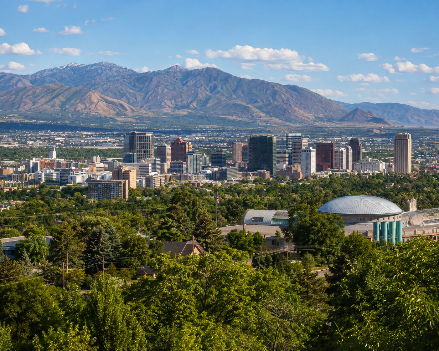 Salt Lake City skyline with the Wasatch Mountains in the distance.