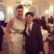 woman in white dress stands next to a man in a suit.