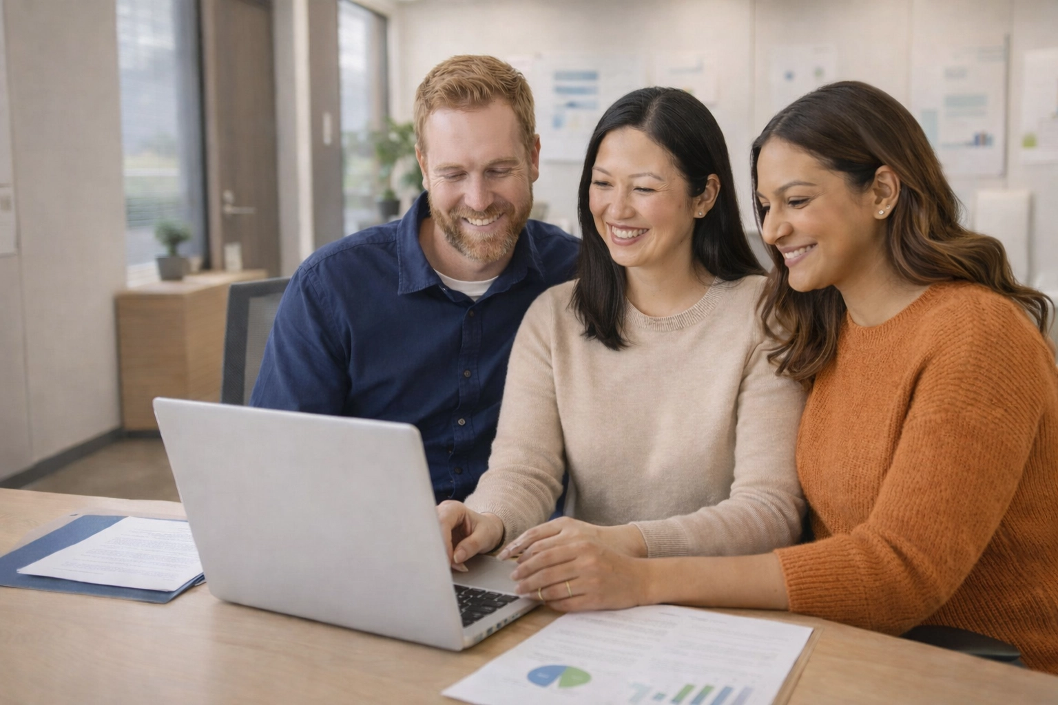 Two Intended Parents and a Surrogate reviewing surrogacy escrow information together on a computer
