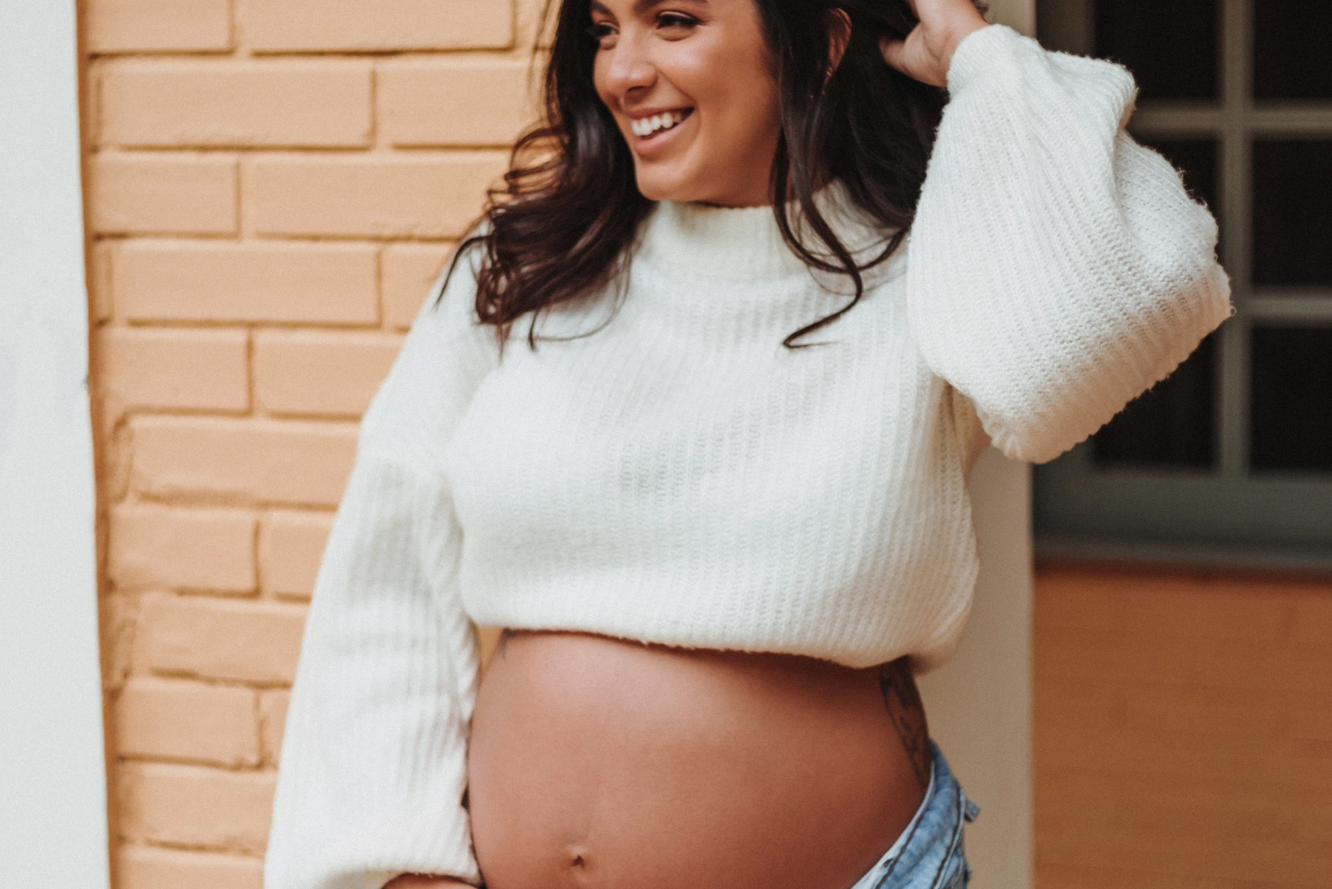 Surrogate smiling during her surrogacy experience with agency guidance